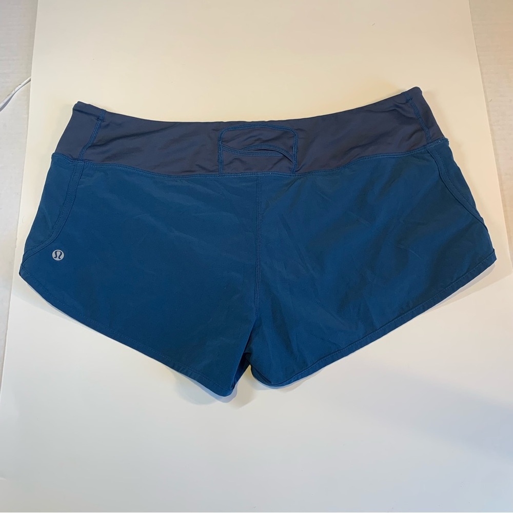 Size 10 Lululemon teal running shorts with turquoise liner
